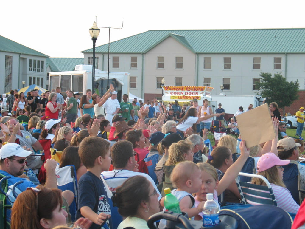 Fans cheering in the crowd at a Woody Bradshaw show